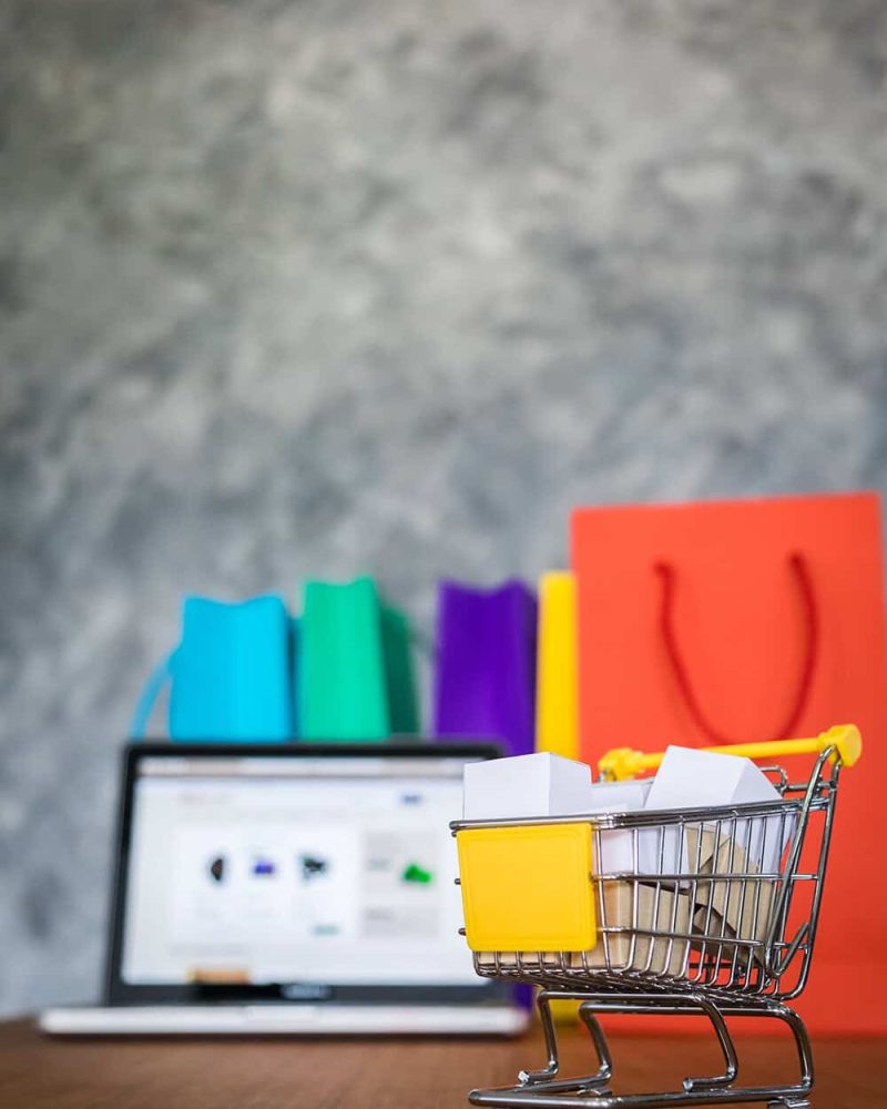 laptop and shopping bags, online shopping concept.